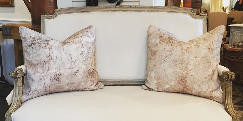 a living room filled with furniture and a fireplace